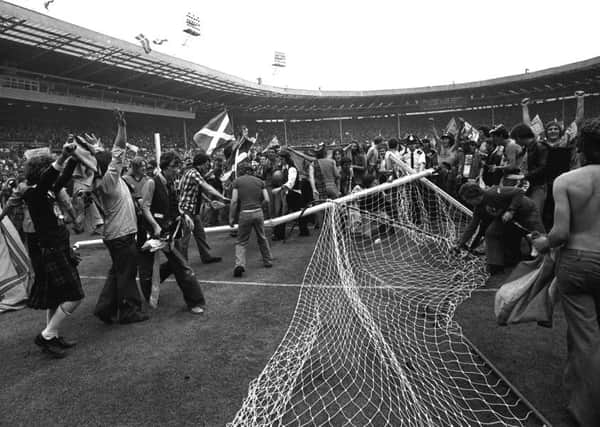 BIG DAY OUT: Thousands of Scottish fans run wild on the pitch at Wembley Stadium after Scotland's 2-1 victory over England in the Home Championships in June 1977.