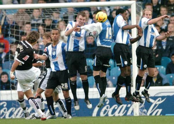 Derby player Inigo Idiakez attempts to lift a free-kick above the Sheffield Wednesday wall in 2005