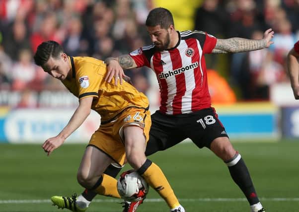 Kieron Freeman of Sheffield United tussles with Sam Hart of Port Vale. (Picture: Simon Bellis/Sportimage)