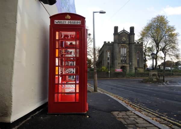 A telephone box at Warley, Halifax, has been turned into a museum after it was adopted by the community. PIC: Simon Hulme