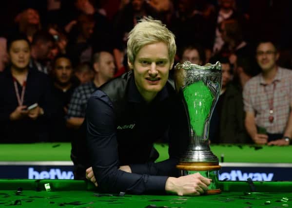 Neil Robertson celebrates with the UK Championship trophy.