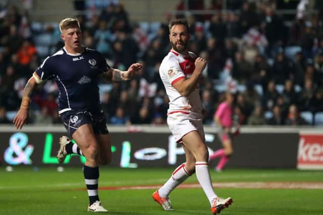 England's Luke Gale celebrates scoring his side's sixth try against Scotland. Picture: Simon Cooper/PA.