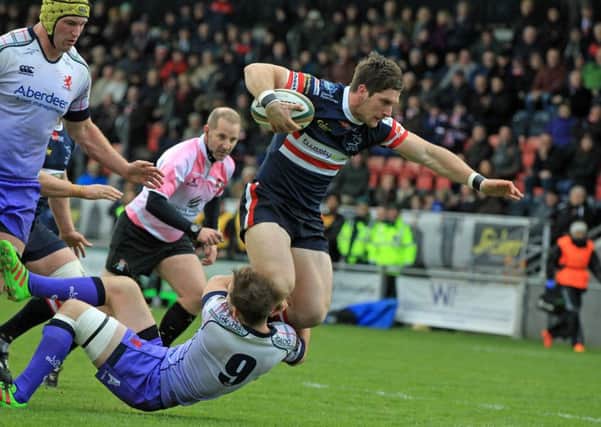 TRY ME: Doncaster Knight' David Clark attacks the London Scottish line. Pictures: Chris Etchells