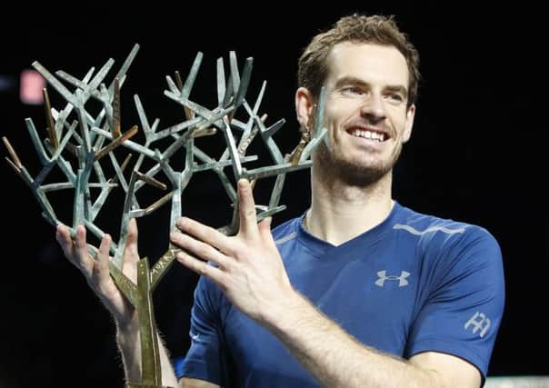 Andy Murray holds the trophy after winning the final of the Paris Masters tennis tournament against John Isner in Paris. Picture: AP/Michel Euler