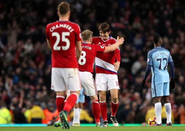 Middlesbrough's Marten de Roon celebrates scoring his side's equaliser against Manchester City with Adam Clayton . Picture: Martin Rickett/PA