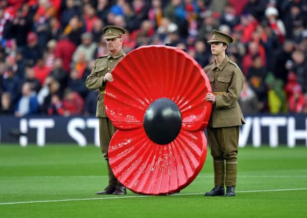 A giant poppy at a Premier League match but is the symbol of remembrance being devalued?