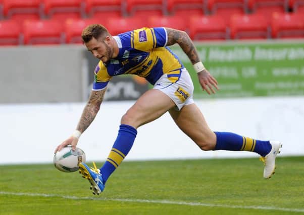 Zak Hardaker pictured scoring a try for Leeds Rhinos against Salford City Reds.