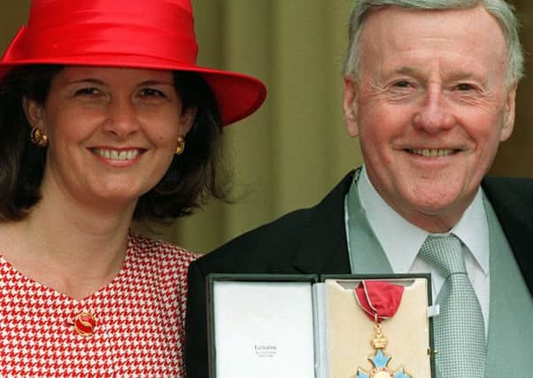 File photo dated 16/03/1993 of Jimmy Young with his partner Alicia Plastow after receiving his CBE from the Queen,  the veteran broadcaster has died "peacefully at home" on Monday aged 95, his spokesman has confirmed. PRESS ASSOCIATION Photo. Issue date: Monday November 7, 2016. See PA story DEATH Young. Photo credit should read: Martin Keene/PA Wire