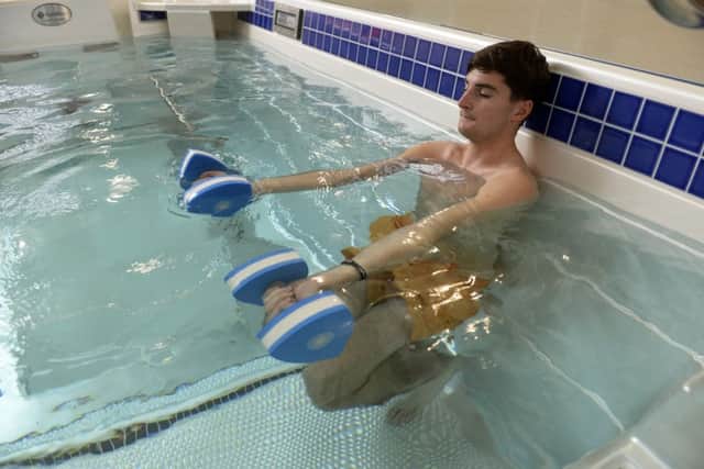 Henry Brooke in the hydrotherapy pool with strength and conditioning coach  Danny Haque.  Picture by Bruce Rollinson.