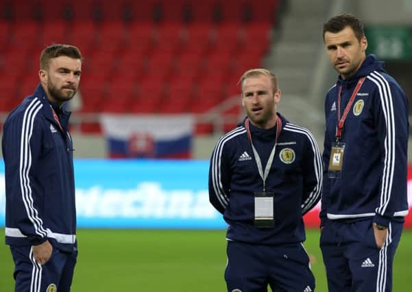 David Marshall, right, pictured with Scotland team-mates James Morrison and Barry Bannan (Picture: Nick Potts/PA Wire).