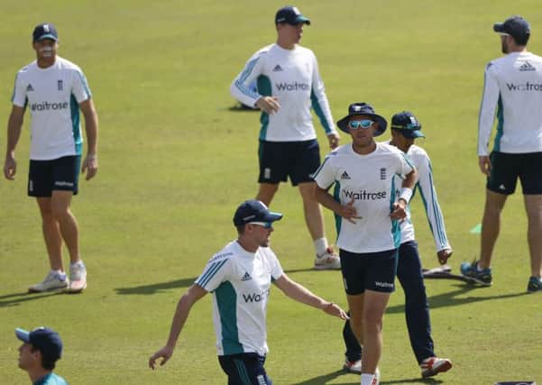 England's cricketers warm up during a practice session ahead of their first Test match with India in Rajkot.