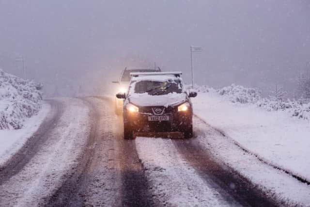Commuters battle their way to work on a snowy morning on Ilkley Moor.  Picture: SWNS