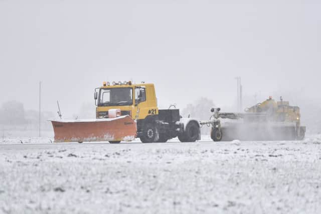 Snow ploughs work to clear the runways at Leeds Bradford airport. Picture: SWNS