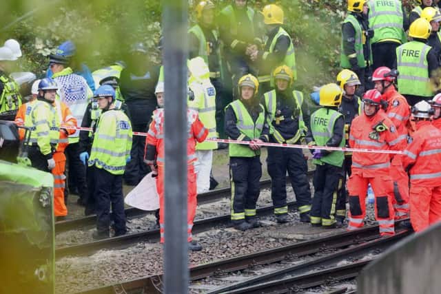 The scene after a tram overturned in Croydon, south London, trapping five people and injuring another 40.
