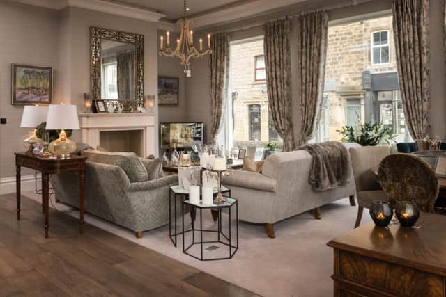 The sitting room showcases fabrics, accessories and the new "on trend" colour - "browny grey"