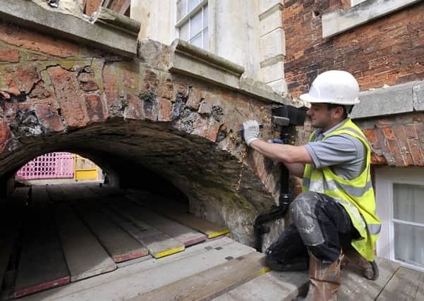 William Anelay Restoration Specialists, York,working on a bridge that supports steps on the South entrance to Beningbrough Hall.