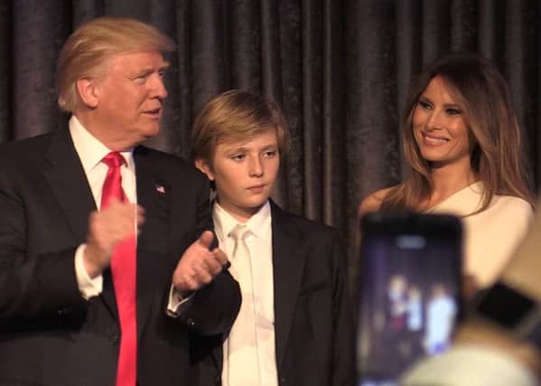 Donald Trump is congratulated by family members after he made his acceptance speech in New York following his victory to become he 45th president of the United States..