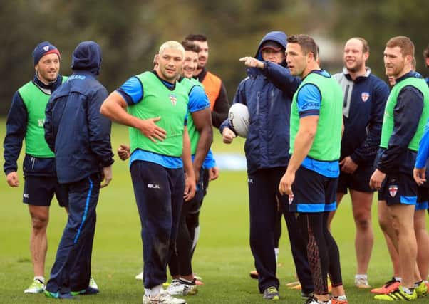 England's head coach Wayne Bennett directs his players during a training session at Eltham College, London.