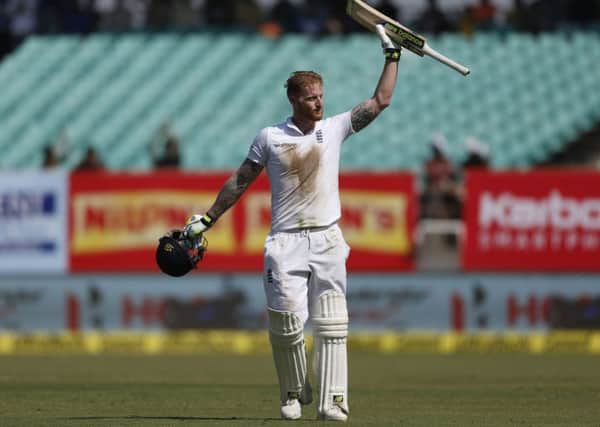 Stoked up: England's batsman Ben Stokes raises his bat after reaching his century (AP Photo/Rafiq Maqbool)
