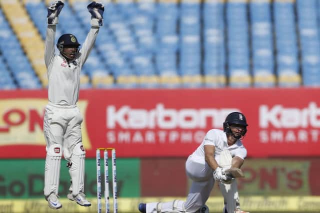 Indian wicketkeeper Wriddhiman Saha left, appeals for the wicket of England's batsman Zafar Ansari (AP Photo/Rafiq Maqbool)