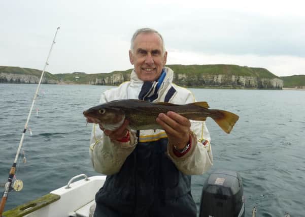 Stewart Calligan with one of the cod caught on the last sea fishing trip of the season.