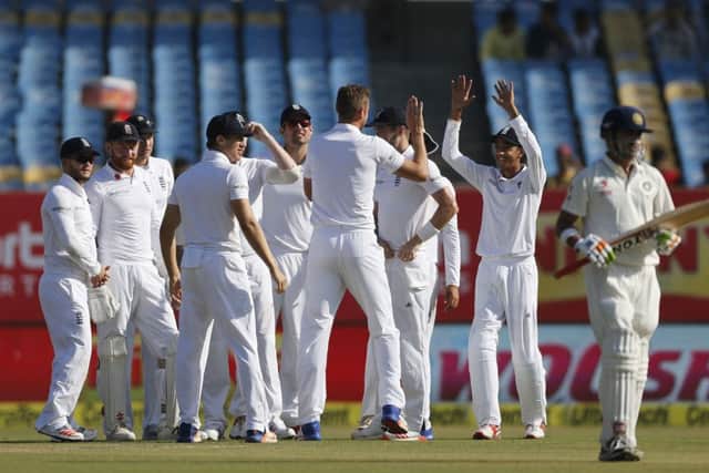 England's cricketers celebrate the wicket of Indian batsman Gautam Gambhir (AP Photo/Rafiq Maqbool)