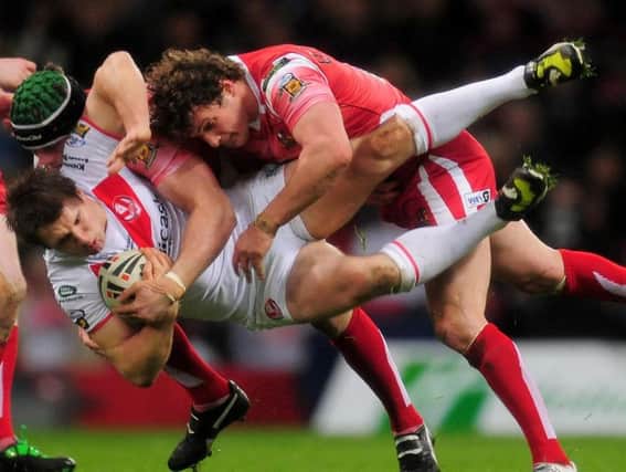 Paul Clough is tackled when playing for former club St Helens