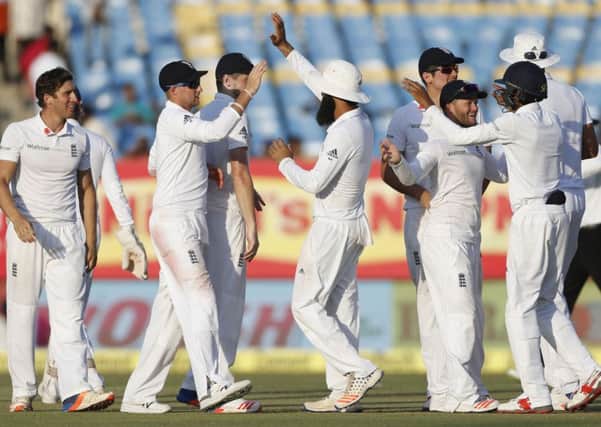 England players celebrate the wicket of Indian batsman Amit Mishra (AP Photo/Rafiq Maqbool)