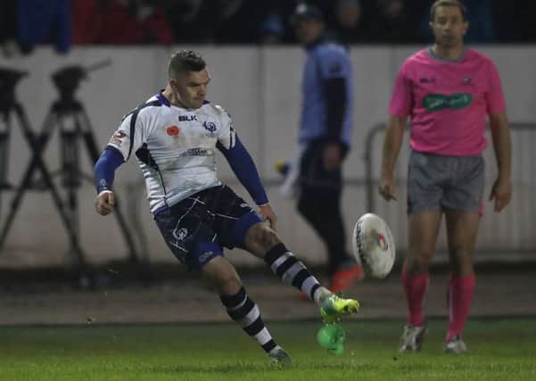 Scotland's Danny Brough kicks a conversion to tie the scores against New Zealand.