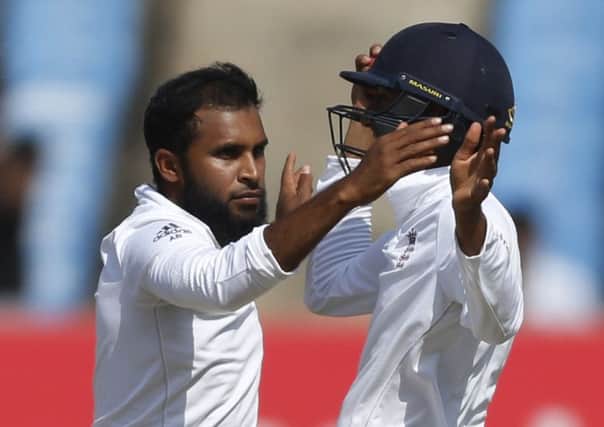 Adil Rashid, left, celebrates the wicket of Indian batsman Ravindra Jadeja with Haseeb Hameed (AP Photo/Rafiq Maqbool)