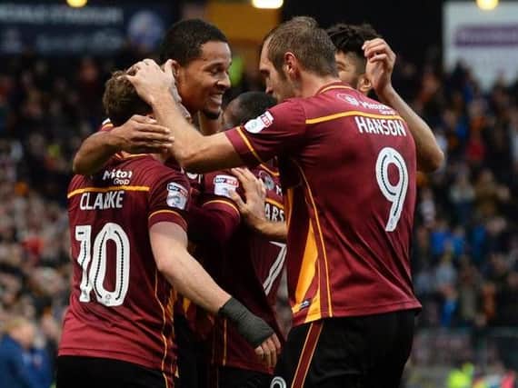 The Bradford squad celebrate Timothee Dieng's goal