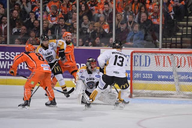 NICE TIMING: Jesse Schultz, far left, tips home from Ben O'Connor to give Sheffield Steelers a 7-0 lead against Nottingham Panthers. Picture: Dean Woolley.