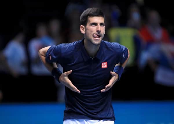 Serbia's Novak Djokovic celebrates winning his match against Austria's Dominic Thiem during day one of the Barclays ATP World Tour Finals at The O2 in London. Picture: Adam Davy/PA