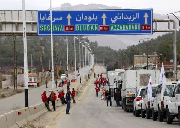 Library picture of a convoy of vehicles loaded with food and other supplies organized by The International Committee of the Red Cross, outside Damascus, Syria.