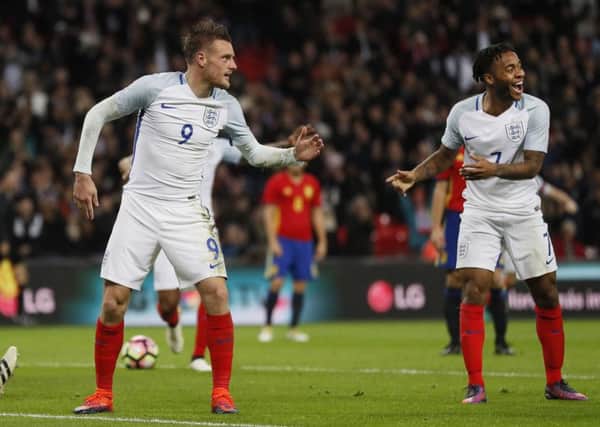 England's Jamie Vardy and Raheem Sterling celebrate with a mannequin challenge in front of Spain goalkeeper Pepe Reina (AP Photo/Kirsty Wigglesworth)