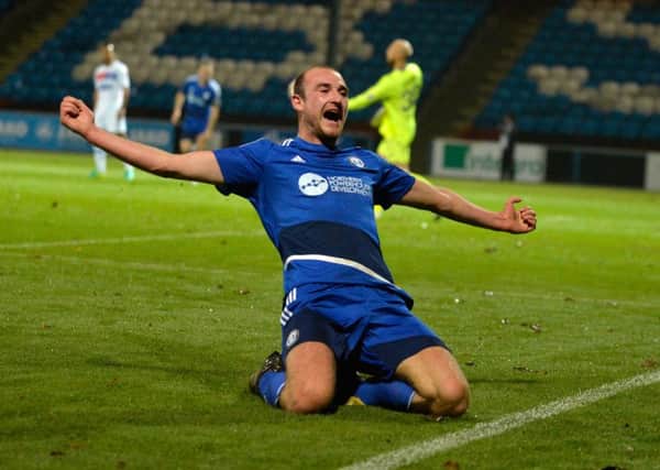 Tom Denton celebrates his opening goal for FC Halifax Town. Picture Bruce Rollinson