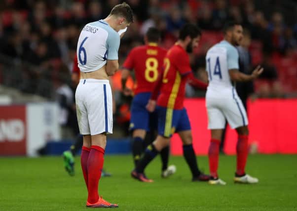 Englands John Stones stands dejected after Spains Isco had equalised in stoppage time for the visitors who had trailed 2-0 (Picture: Nick Potts/PA Wire).