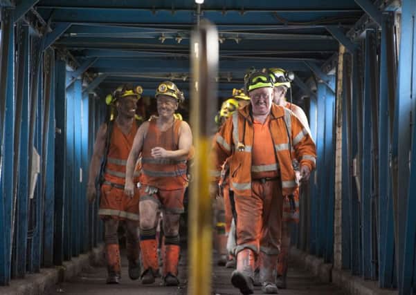 Some of the last miners at Kellingley Colliery coming off a shift. Picture by Roger Tiley.