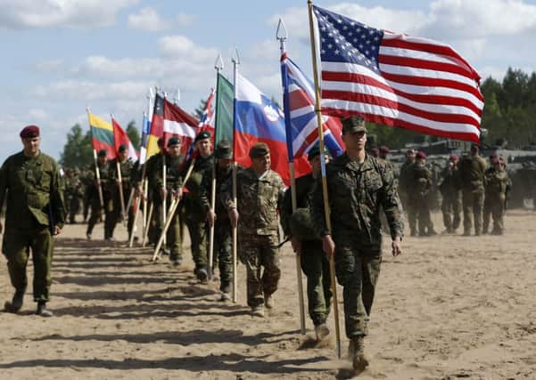 Soldiers from NATO countries attend an opening ceremony of a military exercise in Lithuania last year. (PA).