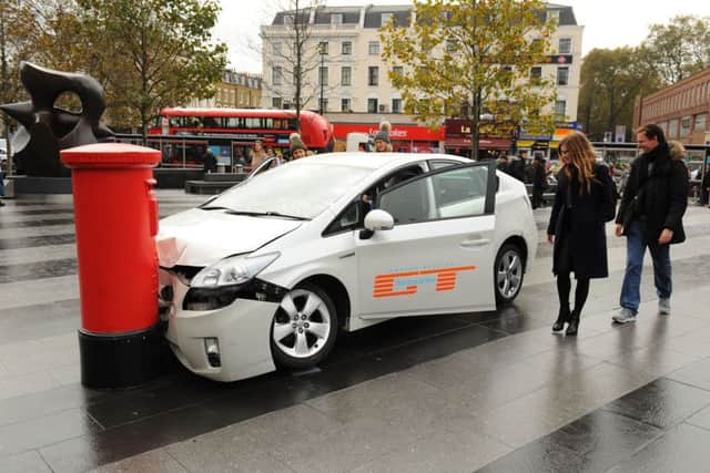 A 'crashed' car outside London's Kings Cross Station to promote The Grand Tour