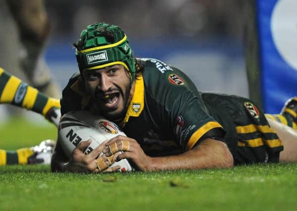 Australia's Johnathan Thurston celebrates as he goes over to score a try during the Four Nations Final match at Elland Road, Leeds. (Picture: Anna Gowthorpe/PA Wire)