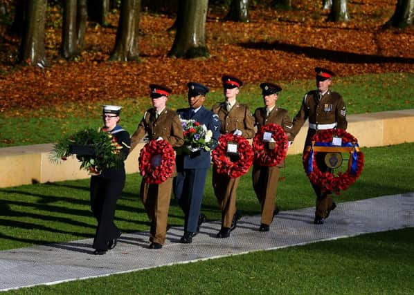 Soldiers lay a wreath during a service at the Thiepval Memorial in northern France to mark the centenary of the final day of the Battle of the Somme