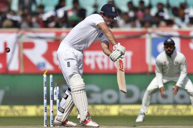 Captain Alastair Cook is bowled out by India's Mohammed Shami in Visakhapatnam. Picture: AP/Aijaz Rahi