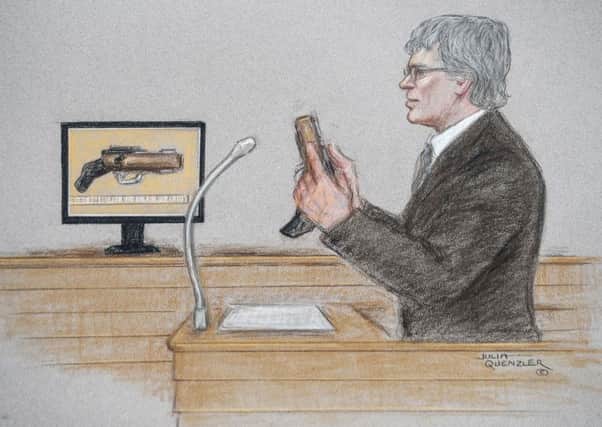 Andre Horne, a firearms expert, shows the gun allagedly used by Thomas Mair, in a court artist's sketch during the Jo Cox murder trial at the Old Bailey. Picture: SWNS