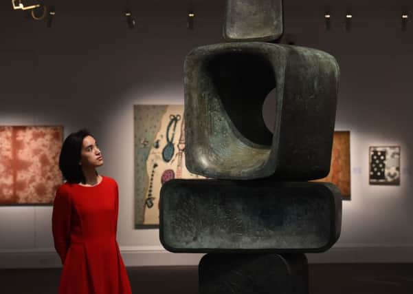Staff at Sotheby's, London, stand next to a sculpture titled Parent I, 1970, by Dame Barbara Hepworth in the Modern & Post-War British Art section and estimated at Â£2,000,000 - Â£3,000,000, which makes up part of Sotheby's forthcoming National Treasures auctions.