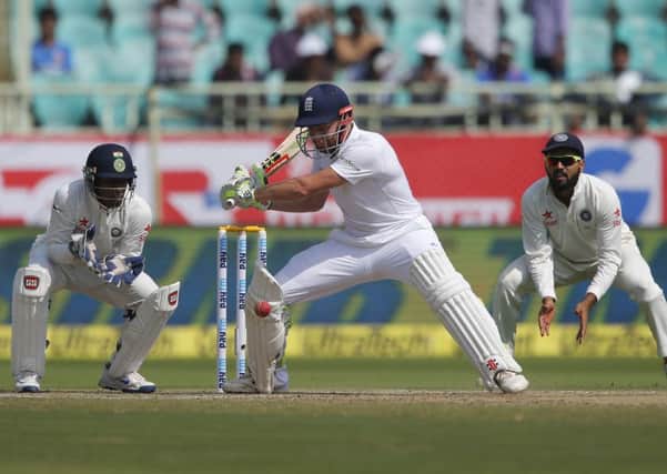 Jonny Bairstow, center, plays a shot on the third day of their second cricket test match against India in Visakhapatnam, India, Saturday, Nov. 19, 2016. (AP Photo/Aijaz Rahi)