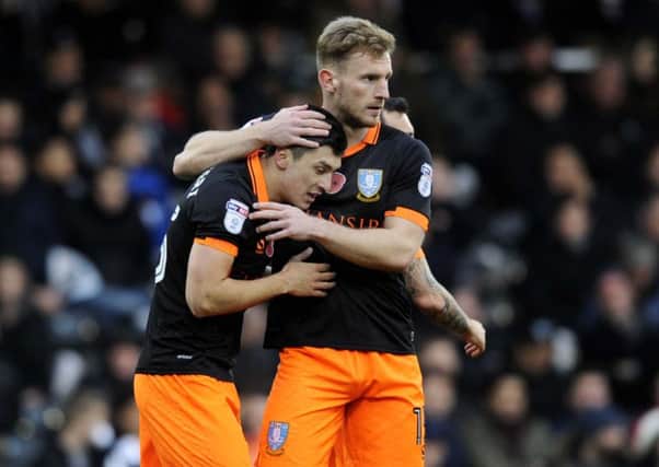 Fernando Forestieri is congratulated after putting Sheffield Wednesday ahead at Fulham (Picture: Steve Ellis).