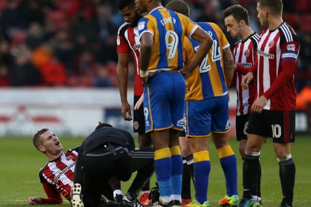 Paul Coutts of Sheffield United lies injured. (Picture: Simon Bellis/Sportimage)