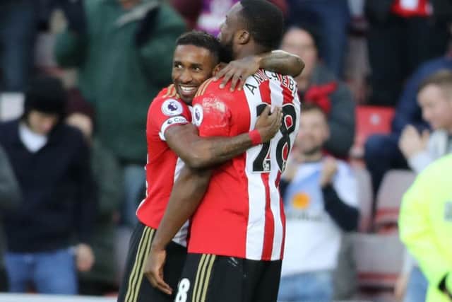 Sunderland's Jermain Defoe (left) celebrates scoring his side's first goal of the game with teammate Victor Anichebe