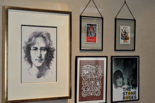 The picture wall with a John Lennon print and copies of Lester's favourite Bond film posters.